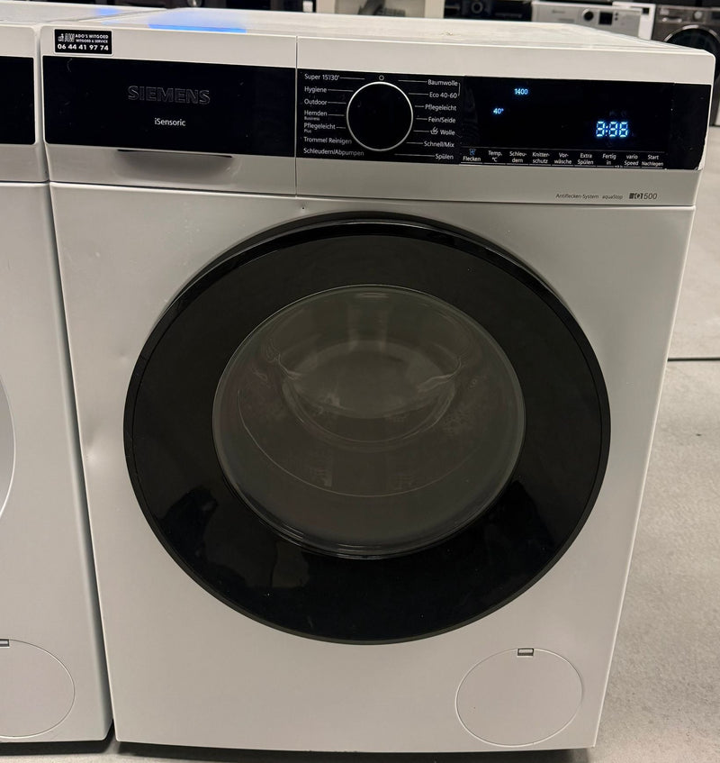 Siemens WG44G2040 wasmachine met geopende deur en zicht op de trommel